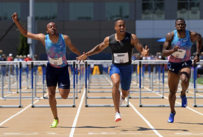 Sacramento, CA, USA; Aleec Harris (center) celebrates after defeating Aries Merritt (left) to win the 110m hurdles, 13.24 to 13.31, during the USA Track and Field Championships at Hornet Stadium. David Oliver (right) was fifth in 13.51. Mandatory Credit: Kirby Lee